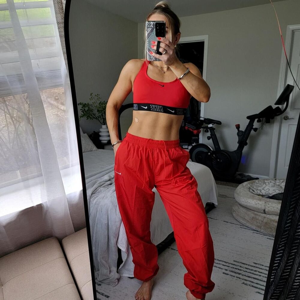 NWT NIKE women's jogger/track pants in bright red.